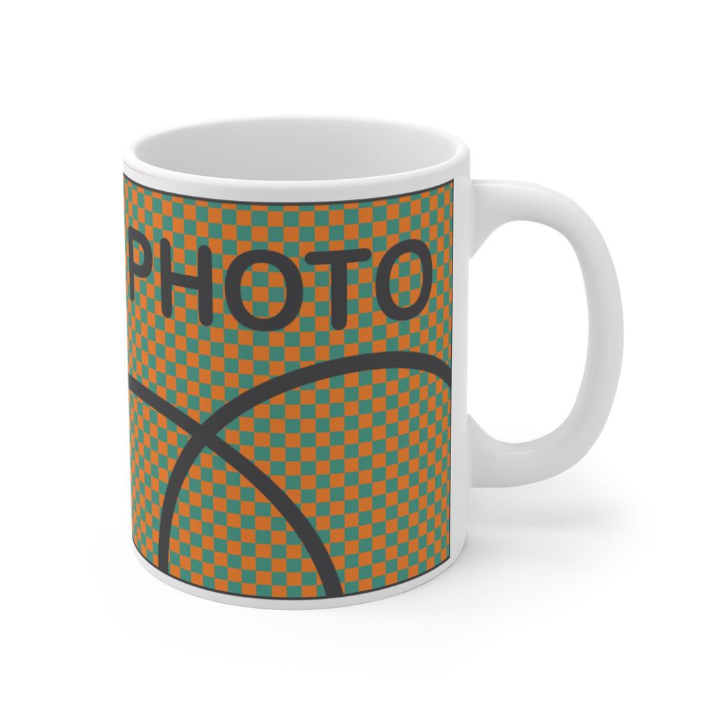 Mug with basketball design and 'PHOTO' text on a white background