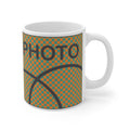 Mug with basketball design and 'PHOTO' text on a white background